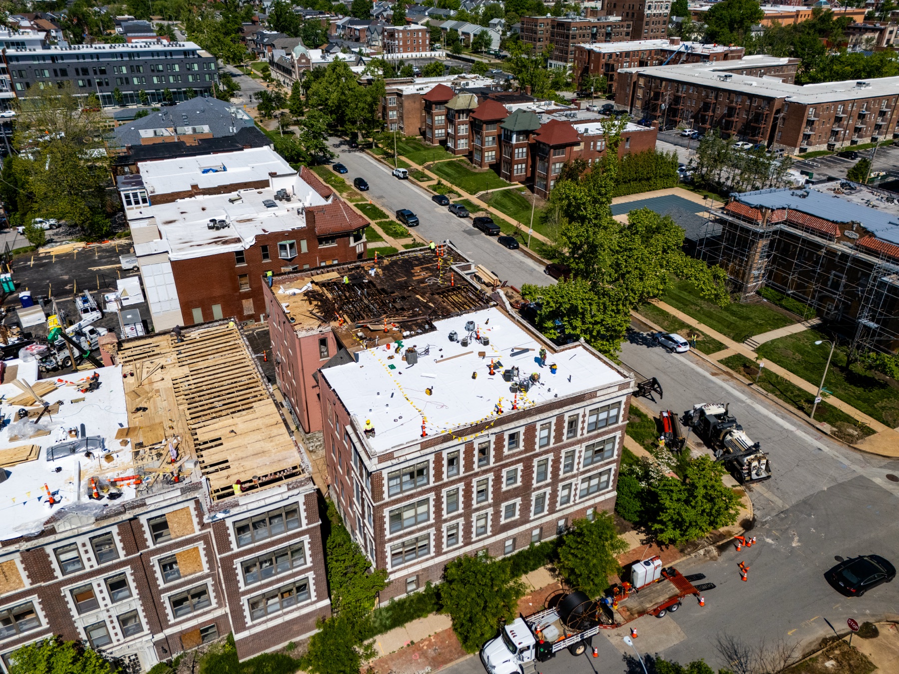 Aerial overview of Gringo Roofing's commercial roof replacement at 5636 Waterman Boulevard