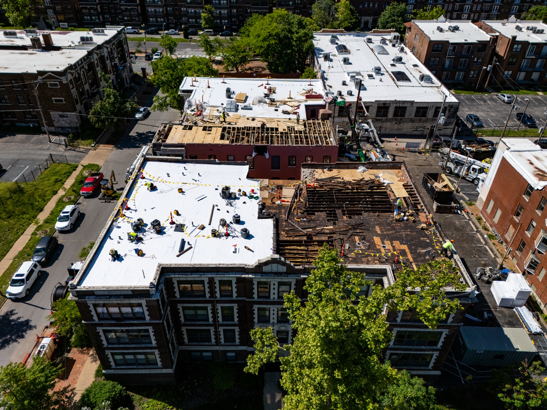 Oblique aerial view of Gringo Roofing work across the Waterman Boulevard rooftop