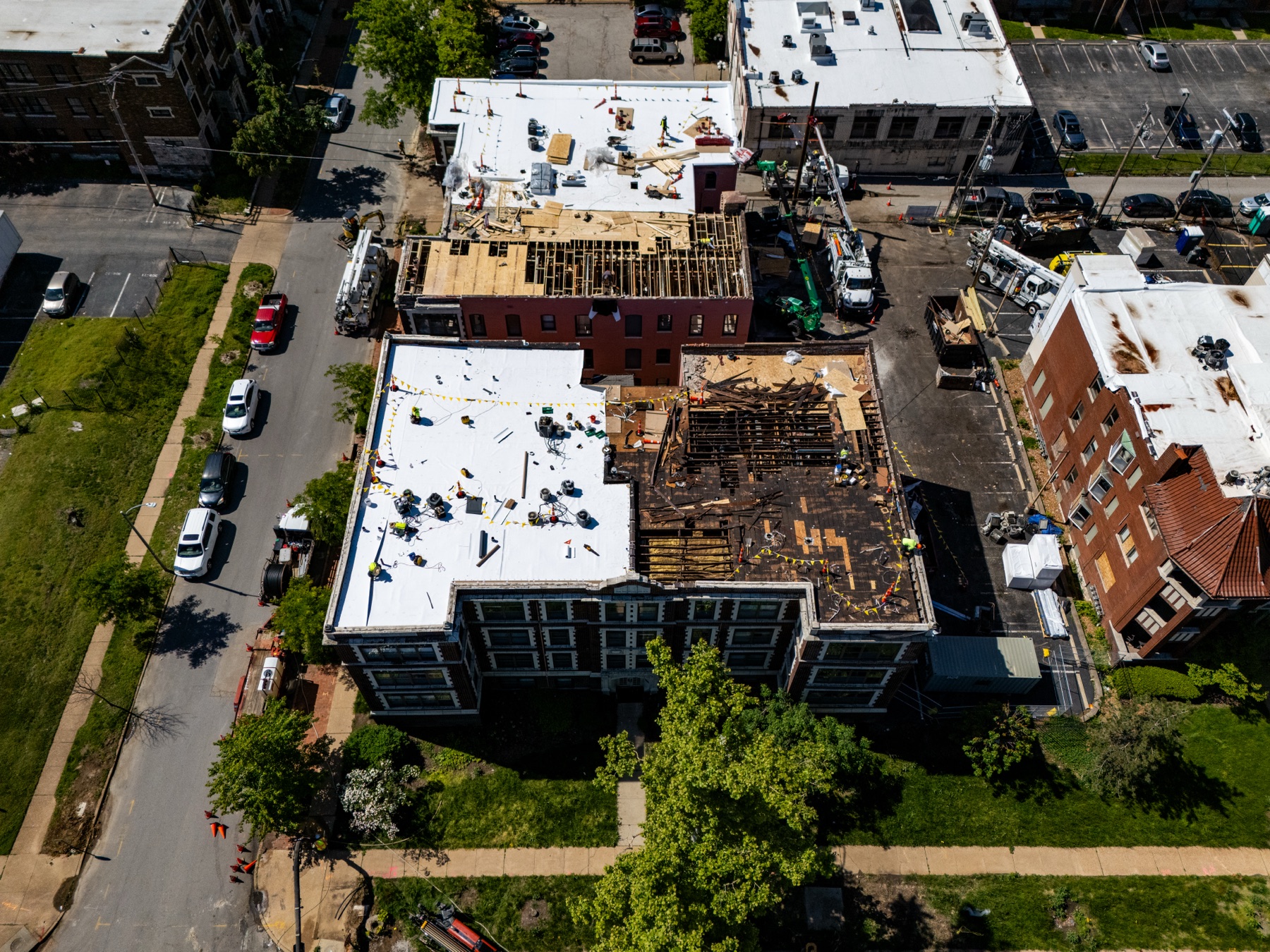 Aerial view of neighboring buildings around the Gringo Roofing project